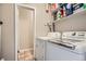 Practical laundry area with modern washer and dryer units at 15139 E Wesley Ave, Aurora, CO 80014