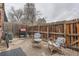 Outdoor patio with BBQ, furniture set, wooden fence, and bike at 15139 E Wesley Ave, Aurora, CO 80014