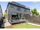 Charming backyard with a patio, dining area, and grassy lawn, perfect for outdoor living and entertaining at 3932 Kalamath St, Denver, CO 80211