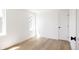 Bright, empty bedroom with hardwood floors and natural light, creating a peaceful and inviting space at 3932 Kalamath St, Denver, CO 80211