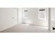 Bright bedroom featuring a plush carpet, white walls, sliding closet door, and black door fixtures at 3932 Kalamath St, Denver, CO 80211
