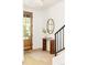Light-filled foyer with hardwood floors and modern staircase at 3932 Kalamath St, Denver, CO 80211