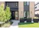 Inviting home facade with a glass-paneled front door and dark accents at 3932 Kalamath St, Denver, CO 80211