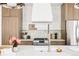 Close up on kitchen details featuring light wood cabinets, stainless appliances, and white countertops at 3932 Kalamath St, Denver, CO 80211