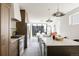 Bright kitchen boasts a large island, pendant lighting, stainless appliances, and wood cabinets at 3932 Kalamath St, Denver, CO 80211