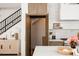 Kitchen area featuring a pantry, stainless appliances, white backsplash, and marble countertops at 3932 Kalamath St, Denver, CO 80211