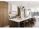 Elegant kitchen featuring a large island, marble countertops, and modern appliances at 3932 Kalamath St, Denver, CO 80211