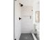 Modern shower with sleek tiles, black hardware, and glass door, offering a spa-like experience at 3932 Kalamath St, Denver, CO 80211