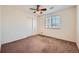 Bedroom has carpet flooring, a double door closet, and a bright window for natural light at 15786 Randolph Pl, Denver, CO 80239