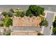 This aerial view features townhome rooftops with numerous skylights and an adjacent parking area at 2092 S Helena St # C, Aurora, CO 80013