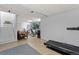 Spacious basement with stairs, tile floors, and workout equipment for a comfortable living space at 2092 S Helena St # C, Aurora, CO 80013