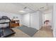 Spacious basement area with a treadmill, plenty of storage, and a laundry room at 2092 S Helena St # C, Aurora, CO 80013