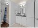 Well-lit bathroom featuring a vessel sink, framed mirror, and a tub with shower at 2092 S Helena St # C, Aurora, CO 80013