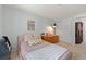 Cozy bedroom with neutral color scheme, carpeted floor, and ample closet space at 2092 S Helena St # C, Aurora, CO 80013