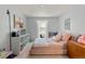 Comfortable ' bedroom with carpeted floor, a big window, shelving, and cute decor at 2092 S Helena St # C, Aurora, CO 80013