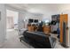 Upstairs loft conversion featuring gaming and workspace with adjacent bedroom at 2092 S Helena St # C, Aurora, CO 80013