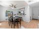 Dining area with modern light fixture open to kitchen and living at 2092 S Helena St # C, Aurora, CO 80013