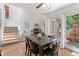 Inviting dining room with staircase and sliding glass doors to patio at 2092 S Helena St # C, Aurora, CO 80013