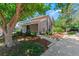Charming home exterior with landscaped front yard, walkway, and mature trees at 2092 S Helena St # C, Aurora, CO 80013