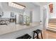 Open kitchen design boasts stainless steel appliances, granite countertops and wooden bar stools at 2092 S Helena St # C, Aurora, CO 80013
