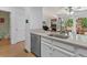 Stainless steel dishwasher blends into the warm, white kitchen decor at 2092 S Helena St # C, Aurora, CO 80013