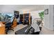 Comfortable living room area with hardwood desk, gaming chair, and chaise lounge seating at 2092 S Helena St # C, Aurora, CO 80013
