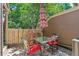 Outdoor patio with mature trees, patio furniture, and a grill creating a relaxing space at 2092 S Helena St # C, Aurora, CO 80013