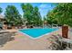 Community pool surrounded by lounge chairs and landscaping for a relaxing atmosphere at 2092 S Helena St # C, Aurora, CO 80013