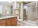 Clean bathroom with shower, granite vanity, and toilet at 4896 S Dudley St # 7-7, Littleton, CO 80123