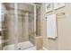 Bathroom with tiled shower, built-in seat, and glass door at 4896 S Dudley St # 7-7, Littleton, CO 80123