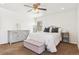 Spacious bedroom with a queen bed, dresser, and carpet at 4896 S Dudley St # 7-7, Littleton, CO 80123