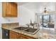 Kitchen with granite counters and double sink at 4896 S Dudley St # 7-7, Littleton, CO 80123