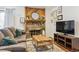Living room with fireplace, TV, and comfortable seating at 4896 S Dudley St # 7-7, Littleton, CO 80123