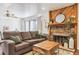 Cozy living room featuring a fireplace and ample seating at 4896 S Dudley St # 7-7, Littleton, CO 80123