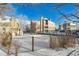 Snow-covered community pool area with building view at 4896 S Dudley St # 7-7, Littleton, CO 80123