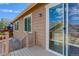 A view of the home's siding as well as the sliding door to the back patio at 1462 Raindrop Way, Castle Rock, CO 80109