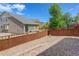 Sloping backyard and fenced yard with low maintenance landscaping at 1462 Raindrop Way, Castle Rock, CO 80109