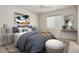 A cozy and serene bedroom with a ceiling fan, large window, and stylish decor at 1462 Raindrop Way, Castle Rock, CO 80109