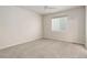 Bright, carpeted bedroom featuring a ceiling fan and a window at 1462 Raindrop Way, Castle Rock, CO 80109