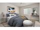 Bedroom featuring a ceiling fan, large window, and a comfortable, neatly made bed at 1462 Raindrop Way, Castle Rock, CO 80109
