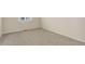 Bedroom with neutral carpet and walls with a large window at 1462 Raindrop Way, Castle Rock, CO 80109