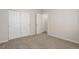 Bedroom features neutral carpet with closet and paneled doors at 1462 Raindrop Way, Castle Rock, CO 80109