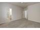 Bedroom featuring carpet flooring and an open doorway leading to bathroom at 1462 Raindrop Way, Castle Rock, CO 80109