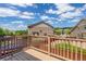 Spacious deck overlooking a lush backyard and neighborhood with mountain views at 1462 Raindrop Way, Castle Rock, CO 80109