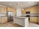 Kitchen with center island, granite countertops, stainless steel appliances, and hardwood floors at 1462 Raindrop Way, Castle Rock, CO 80109