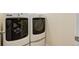 Laundry area featuring a modern white washer and dryer at 1462 Raindrop Way, Castle Rock, CO 80109