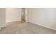 Neutral room with plush carpet and light hardwood flooring leading to other rooms at 1462 Raindrop Way, Castle Rock, CO 80109