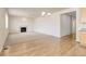 Open concept living room with fireplace and hardwood floors at 1462 Raindrop Way, Castle Rock, CO 80109