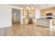 Open floorplan with kitchen, hardwood floors, and carpet at 1462 Raindrop Way, Castle Rock, CO 80109