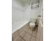 Bathroom with shower/tub combo and tile floor at 2401 S Gaylord St # 103, Denver, CO 80210